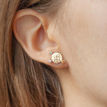 Load image into Gallery viewer, CANON Stud Earrings in 9k gold with diamonds and coloured sapphires with texture on the front on a model | Imprint Collection Margo Orlovik