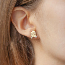 Load image into Gallery viewer, CANON Stud Earrings in 9k gold with diamonds and coloured sapphires with texture on the front on a model | Imprint Collection Margo Orlovik