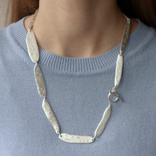 Load image into Gallery viewer, PARAGON ACME II 22 inches silver necklace with clasp visible on a model | Margo Orlovik IMPRINT Collection Contemporary Jewellery
