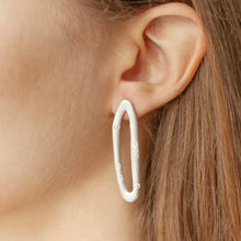 Load image into Gallery viewer, PARAGON DART silver mismatched earrings ON A MODEL | Margo Orlovik IMPRINT Collection Contemporary Jewellery