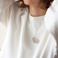 Load image into Gallery viewer, PARAGON I OVAL ORGANIC SHAPED SILVER PENDANT WITH SQUARE TEXTURE ON CHAIN BY MARGO ORLOVIK ON MODEL