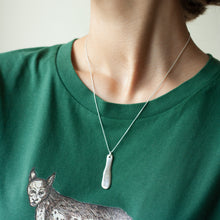 Load image into Gallery viewer, PARAGON VII ORGANIC OBLONG SILVER PENDANT WITH SQUARE PATTERN ON A CHAIN BY MARGO ORLOVIK ON A MODEL