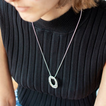 Load image into Gallery viewer, PARAGON VI ROUND SILVER PENDANT ON CHAIN BY MARGO ORLOVIK ON A MODEL