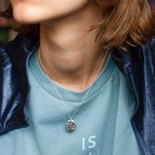 Load image into Gallery viewer, PARAGON V OVAL SILVER PENDANT WITH SQUARE TEXTURE ON CHAIN BY MARGO ORLOVIK ON MODEL