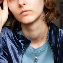 Load image into Gallery viewer, PARAGON V OVAL SILVER PENDANT WITH SQUARE TEXTURE ON CHAIN BY MARGO ORLOVIK ON MODEL