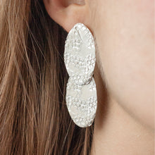 Load image into Gallery viewer, SYNTHESIS Silver Long Earring with two textured ovals on a model | IMPRINT Collection | Margo Orlovik Contemporary Jewellery