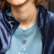 Load image into Gallery viewer, PARAGON V OVAL SILVER PENDANT WITH SQUARE TEXTURE ON CHAIN BY MARGO ORLOVIK ON MODEL
